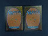 two decks of magic the gathering card game on a table