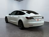 the tesla model 3 is parked in the showroom at the showroom