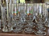 a lot of wine glasses sitting on a table