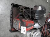a picture of a welding helmet and other tools on a table