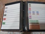 a binder with stamps on it sitting on the floor