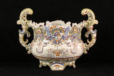 a large vase with a handle on a black background