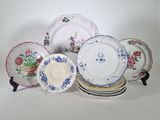 a lot of plates that are sitting on a table