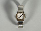 a silver and gold wrist watch with roman numerals on it