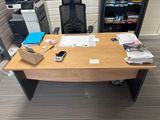a desk with a phone, printer, and other office supplies on it