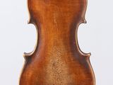 an old violin with a wooden back and a long neck
