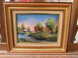 a picture of a painting in a frame on a table