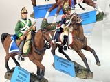 many figurines of soldiers riding horses on display