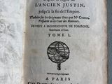an old book with a picture of a man on it