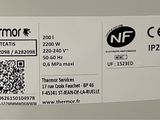 a label on the back of a refrigerator that says thermo