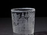 a glass with a picture of a castle on it