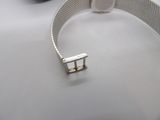 a metal bracelet that has a metal clasp on it