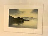 a picture of a picture of a lake with a mountain in the background