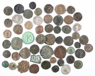 an image of a pile of old coins on a white surface
