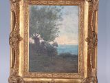 an oil painting of a landscape on a easel with a tree in the foreground