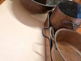 several pots and pans are sitting on a counter in a kitchen