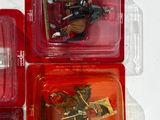 three plastic toy figures of a man riding a horse