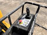a close up of a forklift with a red button