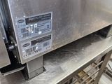 an image of a stainless steel oven in a commercial kitchen