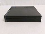 a black dvd player sitting on top of a white surface