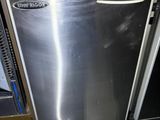 a stainless steel dishwasher in the corner of a kitchen