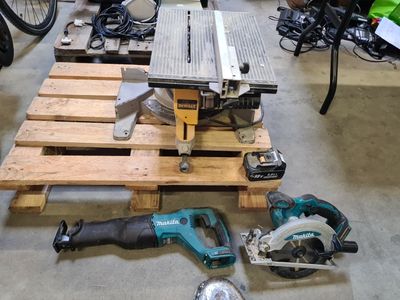a table with a saw, a circular saw, a circular saw, a circular saw, a circular saw, a circular saw, and a circular saw