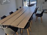 a large wooden table in the middle of a room