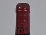 a bottle of wine that is sitting on a table