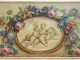 une image représentant un tableau de deux chérubins dans un cadre doré