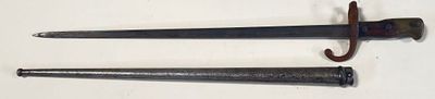 pair of two old swords on a white surface