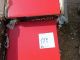two red boxes sitting next to each other on the ground