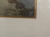 a picture on the wall of a bathroom with a toilet in it