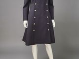 a mannequin dress and coat with buttons on a mannequin mannequin mannequin mann