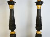 pair of antique black and gold candlesticks with gold accents