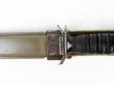a knife that is laying on top of a table