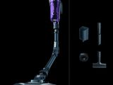 a close up of a purple vacuum on a black background