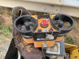 a close up of a machine that is sitting on the ground