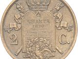 a close up of a coin with a crown on top of it