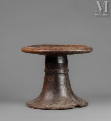 a small wooden table with a wooden top and a metal base