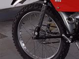 a red and black motorcycle parked in a parking lot