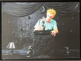 framed photograph of a man with yellow hair holding a glass