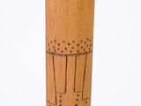 a wooden stick with a drawing of a man on it