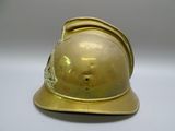 a gold helmet on a white table