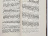 an open book with a black and white image of a horse