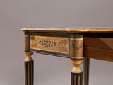 a small desk with a drawer on top of it