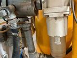 a close up of a machine with a hose attached to it