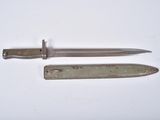 a knife and a knife blade on a white surface