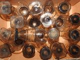 a box full of empty wine glasses and a bottle