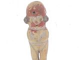 a small figurine of a man with a hat on