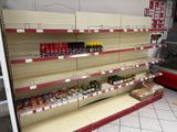 a lot of empty shelves in a grocery store